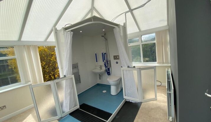 Photo showing a completed Micro WashPod inside a conservatory