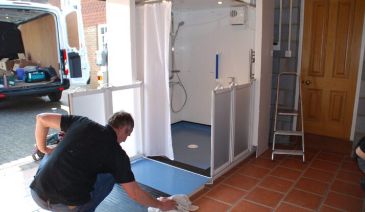Photo of the finishing touches to a WashPod Disabled Wetroom installed in a garage