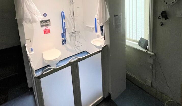 Photo of an Internal Compact WashPod temporary disabled wetroom in a living room