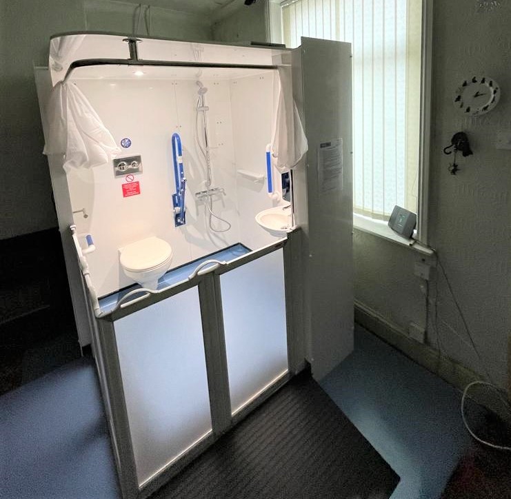 Photo of an Internal Compact WashPod temporary disabled wetroom in a living room