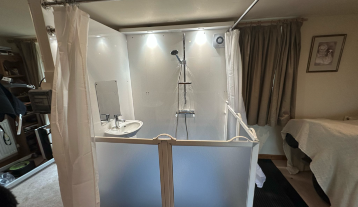 An internal Mini WashPod in a bedroom