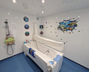 Photo showing the inside of an External Standard WashPod temporary disabled bathroom built for a teen with cerebral palsy at her grandmother's house