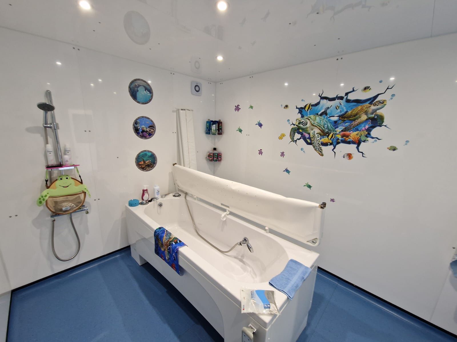 Photo showing the inside of an External Standard WashPod temporary disabled bathroom built for a teen with cerebral palsy at her grandmother's house