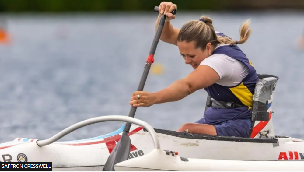 An action photo of Saffron canoeing